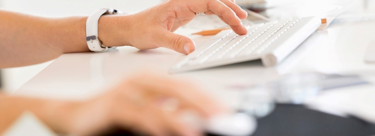 Someone using a keyboard and mouse